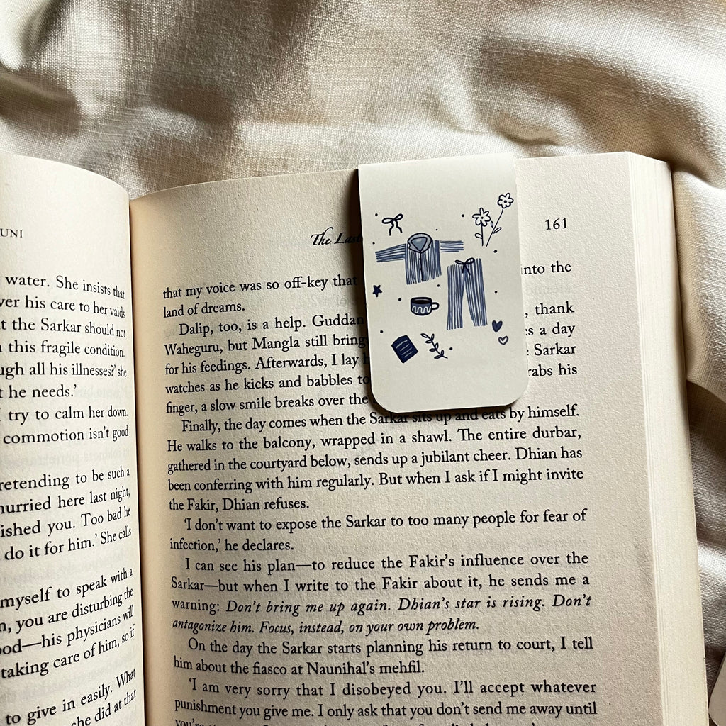 Decorative bookmark with illustrations on an open book