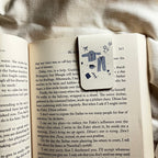 Decorative bookmark with illustrations on an open book