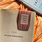 Notebook with a decorative bookmark on a soft fabric background