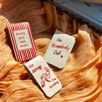 bookmarks set with humorous sayings on a soft fabric background