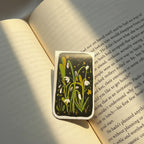 Decorative bookmark with floral design on an open book