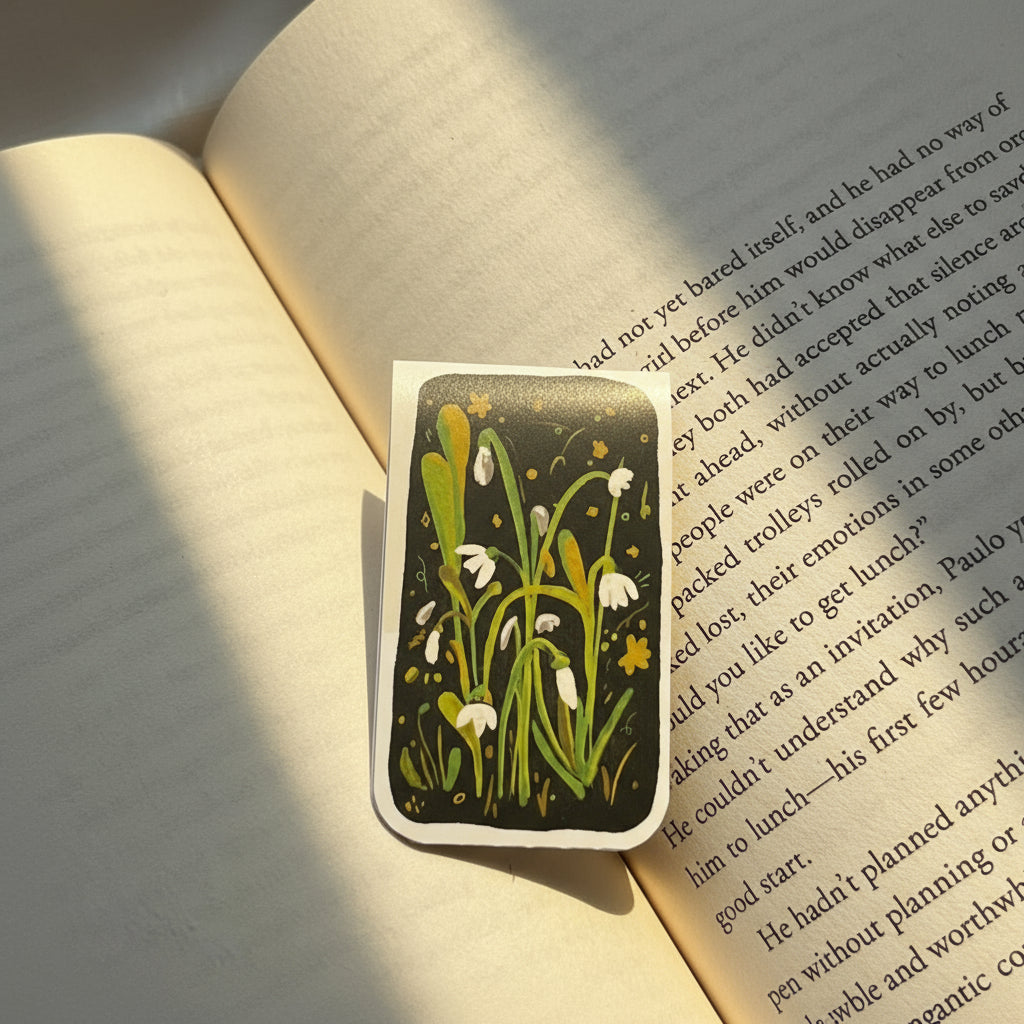 Decorative bookmark with floral design on an open book