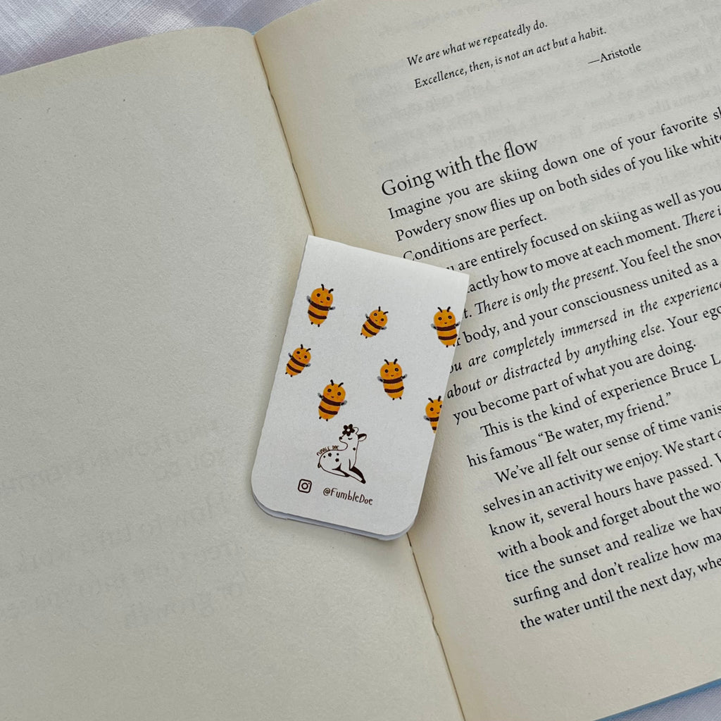 Bookmark with bee pattern on a book