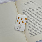 Bookmark with bee pattern on a book